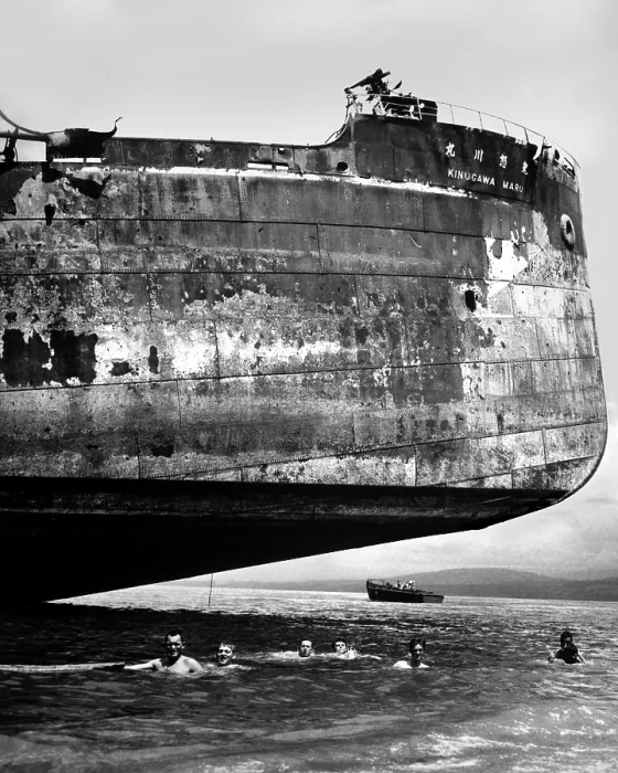 Framed Print : U.S. Coast Guardsmen swim near the wrecked Japanese transport, Kinuga Maru at Guadalcanal Framed Print : U.S. Coast Guardsmen swim near the wrecked Japanese transport, Kinuga Maru at Guadalcanal