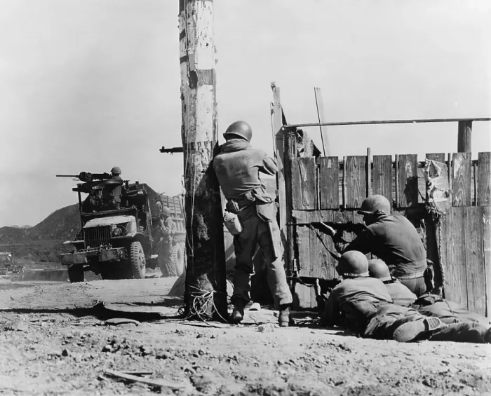 Framed Print : U.S. Combat Engineers return North Korean sniper fire after the Battle of Yongdong, July 31, 1950. Korean War, 1950-53. (BSLOC_2014_11_9)