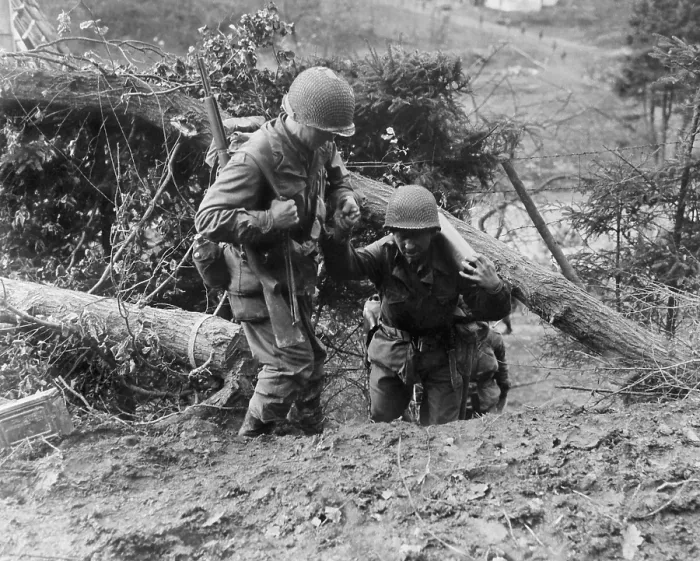 Framed Print : U.S. Infantrymen, in the Hurtgen Forest. One soldier helps another carrying heavy weapon as they climb a steep trail. Nov. 18, 1944. Near Duren, Germany, World War 2 Framed Print : U.S. Infantrymen, in the Hurtgen Forest. One soldier helps another carrying heavy weapon as they climb a steep trail. Nov. 18, 1944. Near Duren, Germany, World War 2