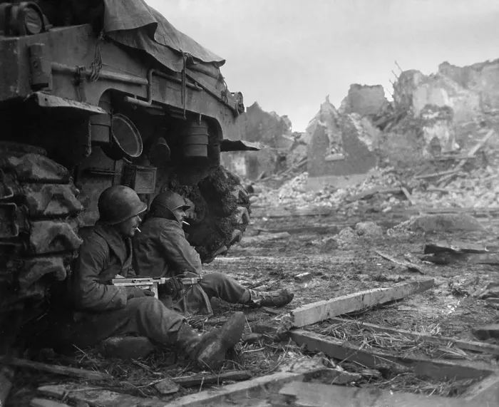 Framed Print : U.S. Infantrymen sheltering behind a M-4 Sherman tank during heavy German shelling. Dec. 11, 1944. Geich, Germany. World War 2. (BSLOC_2014_8_60)