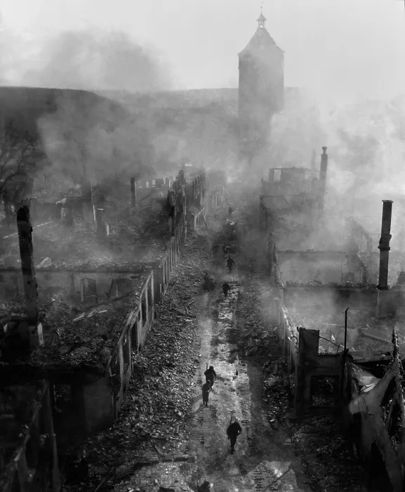 Framed Print : U.S. infantrymen move down a street in Waldenburg during the 7th Army advance. To drive out Wehrmacht die-hards, the U.S. artillery devastated the historic town