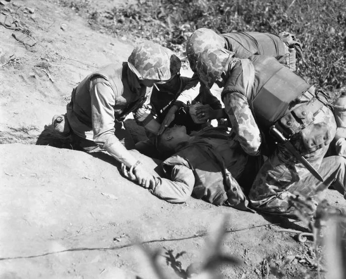 Framed Print : U.S. Marine is given a drink of water as he waits for evacuation to a rear area aid station. Nov. 1952 Framed Print : U.S. Marine is given a drink of water as he waits for evacuation to a rear area aid station. Nov. 1952