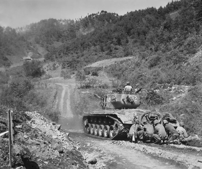 Framed Print : U.S. Marine infantrymen take cover behind a tank while it fires on Communist troops ahead. Hongchon Area, Central Korea, May 22, 1951. Korean War, 1950-53. (BSLOC_2014_11_110) Framed Print : U.S. Marine infantrymen take cover behind a tank while it fires on Communist troops ahead. Hongchon Area, Central Korea, May 22, 1951. Korean War, 1950-53. (BSLOC_2014_11_110)