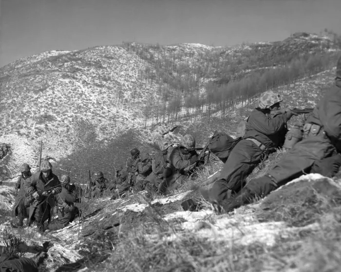 Framed Print : U.S. Marine infantrymen engage Chinese forces at the Chosin Reservoir. They take cover behind large boulders. Dec. 5, 1950. Korean War, 1950-53. (BSLOC_2014_11_89)