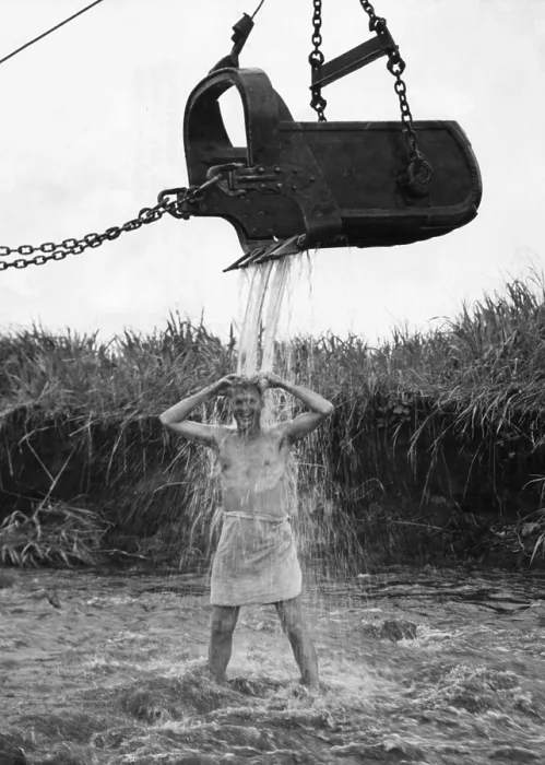 Framed Print : U.S. Marine officer enjoys an early morning shower at Cape Gloucester on New Britain. Water is provided by friendly steam shovel operator, May 10, 1944. - (BSLOC_2014_14_15) Framed Print : U.S. Marine officer enjoys an early morning shower at Cape Gloucester on New Britain. Water is provided by friendly steam shovel operator, May 10, 1944. - (BSLOC_2014_14_15)