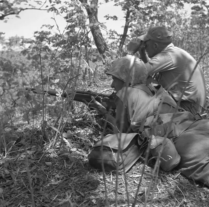 Framed Print : U.S. Marine sniper and spotter work together in picking off the enemy in Korea. Korean War, 1950-53. Exact date / location unknown. (BSLOC_2014_11_128)