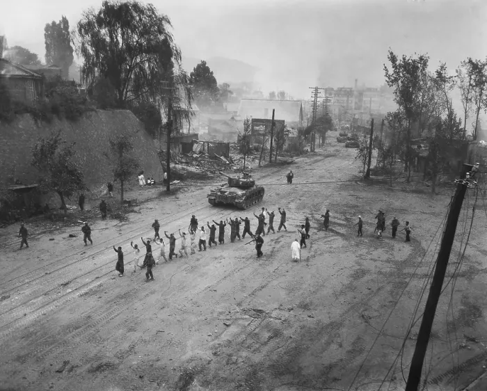 Framed Print : U.S. Marine tank follows a line of prisoners of war down a street. Sept. 26, 1950. Probably near Seoul, Korea. Korean War, 1950-53. (BSLOC_2014_11_163) Framed Print : U.S. Marine tank follows a line of prisoners of war down a street. Sept. 26, 1950. Probably near Seoul, Korea. Korean War, 1950-53. (BSLOC_2014_11_163)