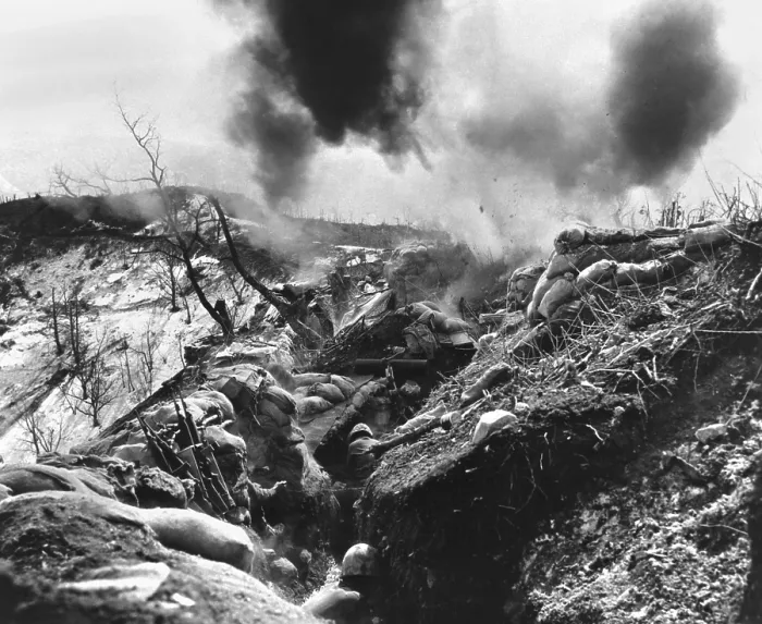Framed Print : U.S. Marines take cover in a deep trench as Red mortar shell lands nearby. May 12, 1952