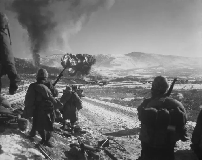 Framed Print : U.S. Marines pause at the roadblock on the way from Hagaru to Kotori in the withdrawal from the Chosin Reservoir. Marine Corsairs napalm an abandoned U.S Framed Print : U.S. Marines pause at the roadblock on the way from Hagaru to Kotori in the withdrawal from the Chosin Reservoir. Marine Corsairs napalm an abandoned U.S