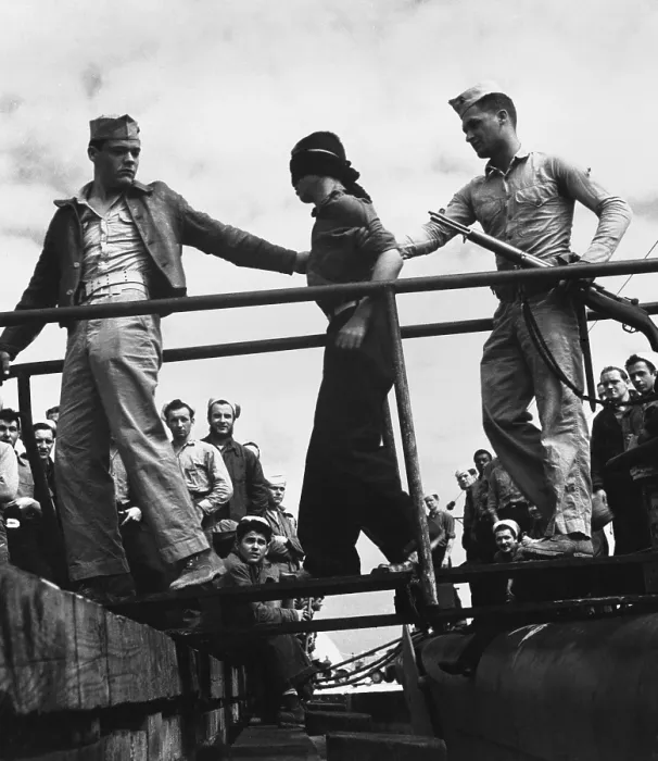 Framed Print : U.S. Marines unloading a Japanese POW from a submarine returned from war patrol. May 1945. World War 2. (BSLOC_2013_14_276) Framed Print : U.S. Marines unloading a Japanese POW from a submarine returned from war patrol. May 1945. World War 2. (BSLOC_2013_14_276)