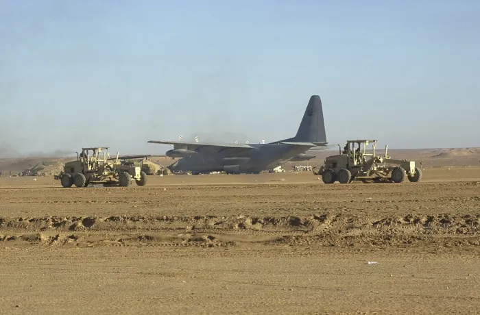 Framed Print : U.S. Navy Seabees run heavy graders down the runway to patch holes and remove excess dirt in the first weeks occupation of Kandahar on Dec. 18 2001