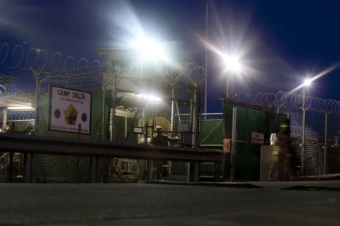 Framed Print : U.S. Sailor exits a controlled entryway after completing a 12-hour shift at Camp Delta Guantanamo Bay Naval Base Cuba June 9 2010. Photo by:Everett Collection(BSLOC_2011_6_156)