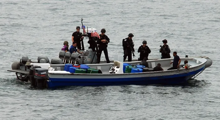 Framed Print : U.S. Sailors and Coast Guardsmen question four suspected drug smugglers after their boat was intercepted in the eastern Pacific Ocean March 31 2010 Framed Print : U.S. Sailors and Coast Guardsmen question four suspected drug smugglers after their boat was intercepted in the eastern Pacific Ocean March 31 2010