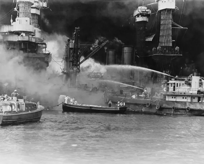 Framed Print : U.S. sailors in fireboats at the side of the burning battleship, USS West Virginia. The ship was struck by at least 7 torpedoes during the Japanese attack on Pearl Harbor, Dec