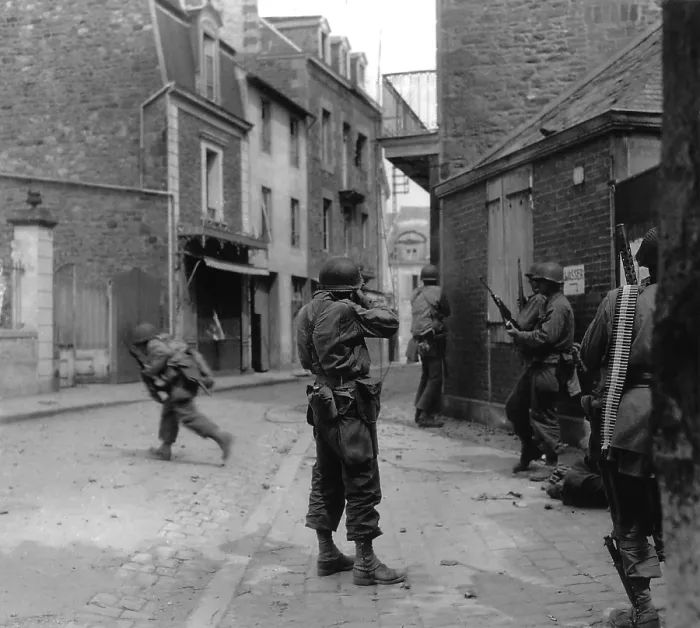 Framed Print : U.S. soldier aims at a German sniper during street fighting in Saint Malo, France, Aug. 8, 1944. The Atlantic port city was captured on Aug. 17, 1944, with the 10, 000 German POWS