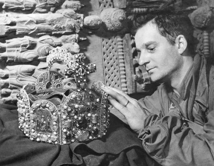 Framed Print : U.S. Soldier with Crown of Charlemagne in a cave in Siegen, Germany. It was among many looted art treasures hidden there and in hundreds of other sites across Germany