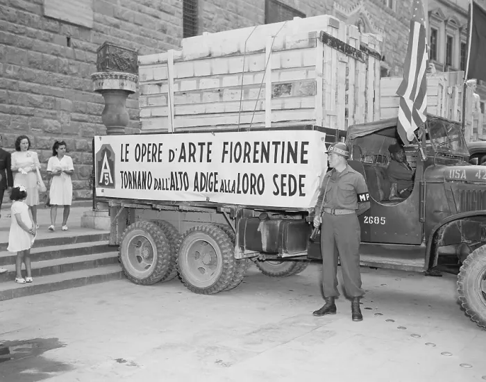 Framed Print : U.S. Soldier guards a truck holding stolen Italian artworks during World War 2. The crated paintings were stolen by the Nazi German army and returned by the U.S