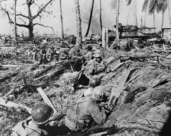 Framed Print : U.S. soldier halts its advance on while a tank blasts Japanese positions on Kwajalein Island. Jan. 31-Feb. 3, 1944. Marshall Islands, World War 2. (BSLOC_2014_10_104)