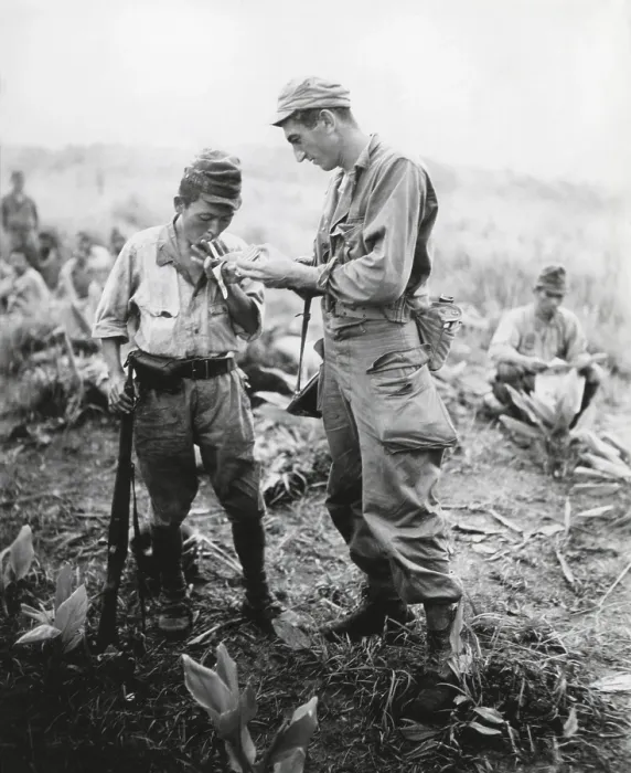 Framed Print : U.S. soldier of lights a cigarette for a former enemy guard Framed Print : U.S. soldier of lights a cigarette for a former enemy guard