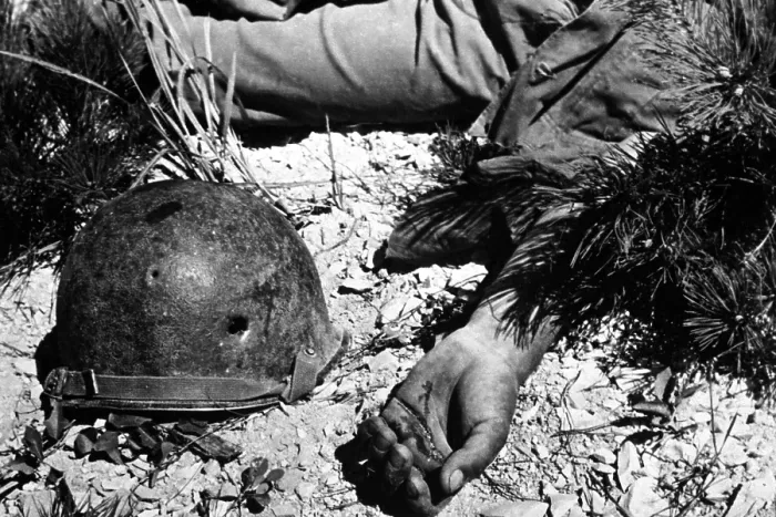 Framed Print : U.S. soldier's bullet-pierced helmet lying next to his body in a South Korean battlefield. He was killed in an advance on Maeson Dong during Korean War. Sept. 2, 1950