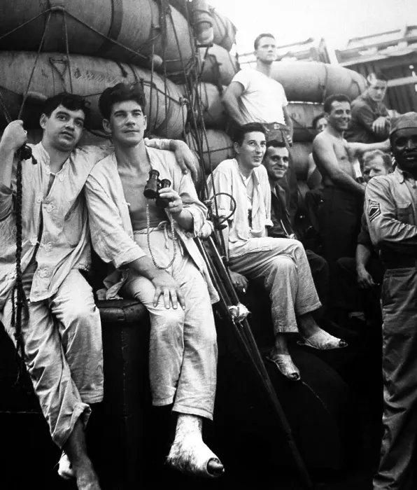 Framed Print : U.S. soldiers have the first glimpse of home from a troopship in July 1944, during World War 2. The group includes wounded men who left their beds to make sure it was true