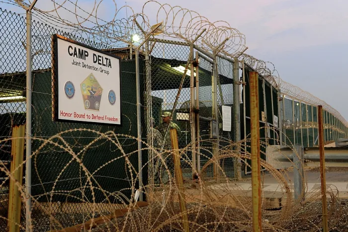 Framed Print : U.S. Soldiers guard a controlled entryway at Camp Delta the Guantanamo Bay military prison at the Naval Base in eastern Cuba
