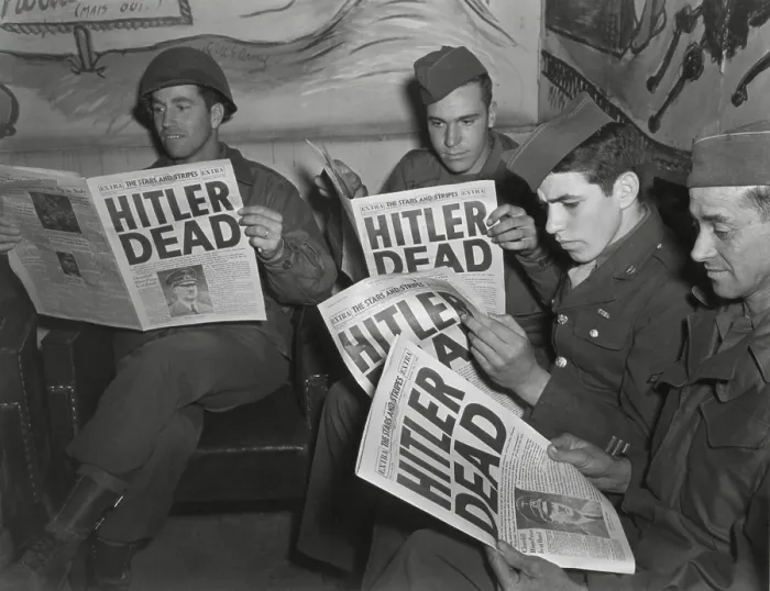 Framed Print : U.S. Soldiers read of Hitler's death in an Extra edition of Starts and Stripes, May 2, 1945