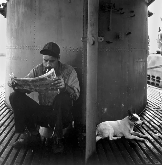 Framed Print : U.S. submariner reading his favorite comic-strip. The submarine mascot rests in the shade of the conning tower. During World War 2, ca. 1942-45. (BSLOC_2013_11_121) Framed Print : U.S. submariner reading his favorite comic-strip. The submarine mascot rests in the shade of the conning tower. During World War 2, ca. 1942-45. (BSLOC_2013_11_121)