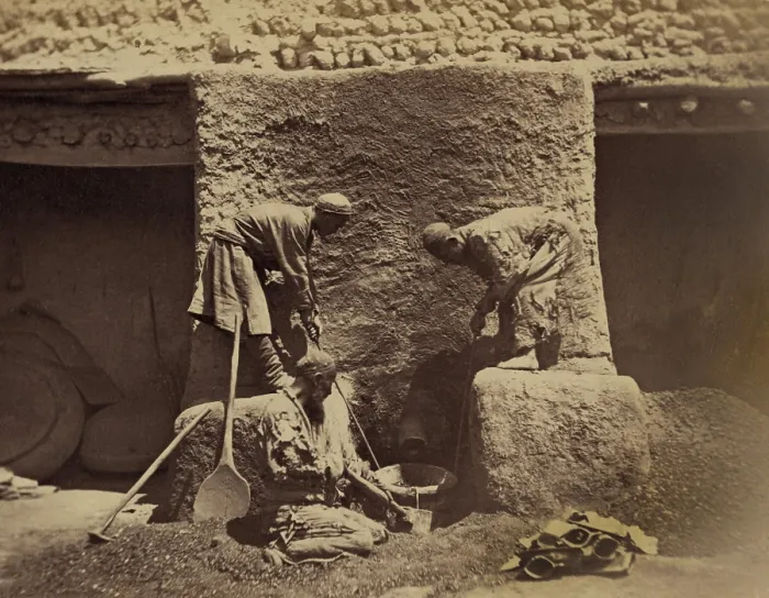 Framed Print : Using centuries old methods, men smelting iron ore in a primitive forge to make cast-iron in Turkestan, Central Asia. Between 1865-1872