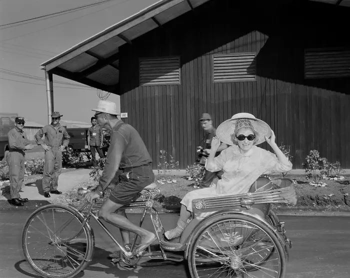 Framed Print : USO entertains troops in Thailand. Comedienne Phyllis Diller rides in a tricycle rickshaw as the Bob Hope USO Christmas show arrives at Korat Air Base, Thailand. Dec. 1966 Framed Print : USO entertains troops in Thailand. Comedienne Phyllis Diller rides in a tricycle rickshaw as the Bob Hope USO Christmas show arrives at Korat Air Base, Thailand. Dec. 1966