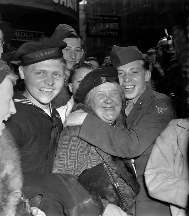 Framed Print : V-E Day celebration in Piccadilly Circus, London, May 7, 1945. A jubilant American soldier hugs a motherly English woman celebrating Germany's unconditional surrender