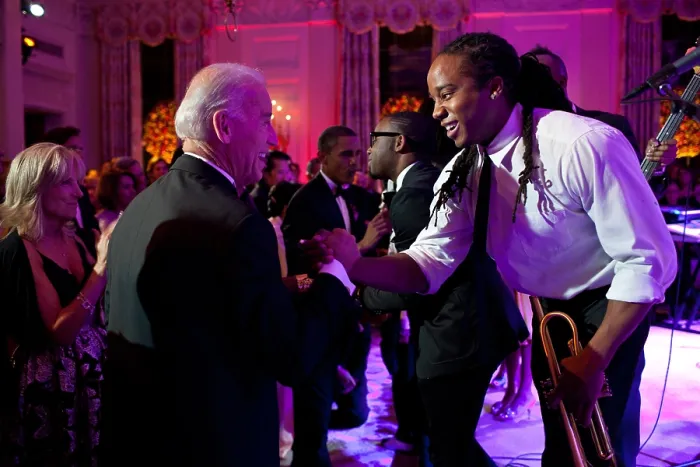 Framed Print : Vice President Joe Biden greets Lance Powlis, a trumpet player in Janelle Monae's band. The group performed in the State Dining Room of the White House, Oct. 13, 2011