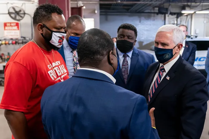 Framed Print : Vice President Mike Pence, wears a black facemask decorated with a Presidential seal
