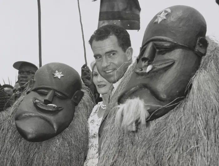 Framed Print : Vice President Richard Nixon standing among Liberian dancers. Underneath the traditional costumes and masks are Goa Devil Dancers. Pat Nixon is partially obscured. March 13, 1957 Framed Print : Vice President Richard Nixon standing among Liberian dancers. Underneath the traditional costumes and masks are Goa Devil Dancers. Pat Nixon is partially obscured. March 13, 1957