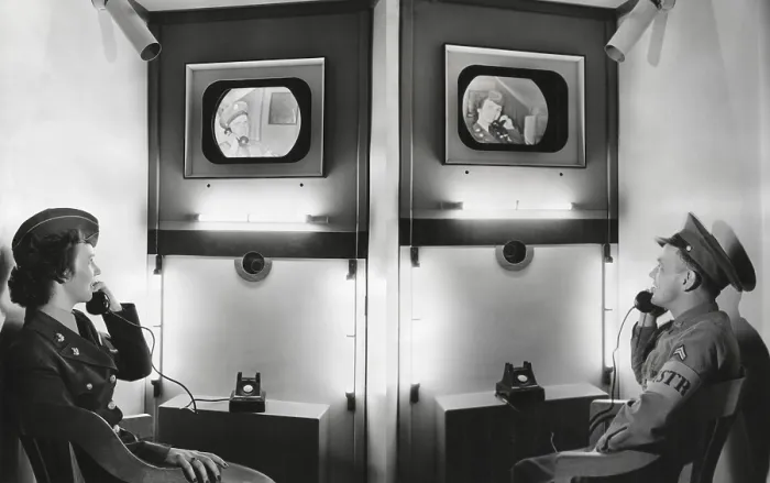 Framed Print : Video telephone conversation between an Army Corporal in Centralia, Pa. and a WAC in Seattle, Wash. Both can see the other in a video-telephone exhibit of the Signal Corps
