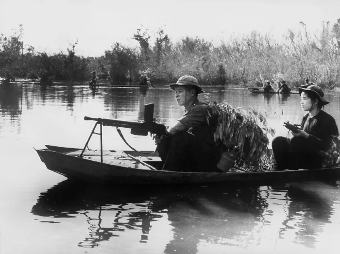 Framed Print : Viet Cong guerrillas in small boats patrol the Saigon River in South Vietnam in photo taken by communist forces Framed Print : Viet Cong guerrillas in small boats patrol the Saigon River in South Vietnam in photo taken by communist forces