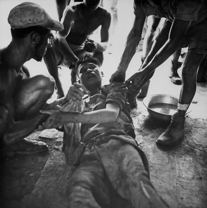 Framed Print : Vietminh POW. A wounded Vietminh prisoner is given first aid by Franco Vietnamese medicals after hot fire fight near Hung Yen, south of Hanoi. Ca