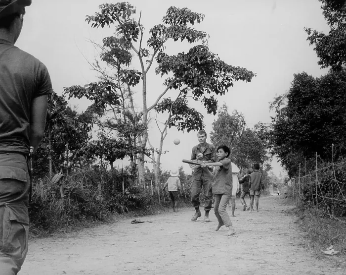 Framed Print : Vietnam Pacification operations. Soldiers of the 101st Airborne Division, join the children of Ap Uu Thoung hamlet, north of Hue, in a game of baseball. Jan. 15, 1970 Framed Print : Vietnam Pacification operations. Soldiers of the 101st Airborne Division, join the children of Ap Uu Thoung hamlet, north of Hue, in a game of baseball. Jan. 15, 1970