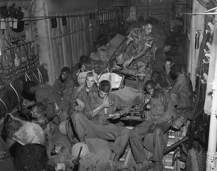 Framed Print : Vietnam War. 101st Airborne Division soldiers an a helicopter enroute to Phi Troung Air Base for a search and destroy mission during Operation Austin. April-May 1966