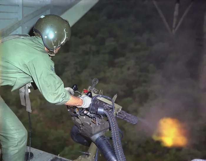 Framed Print : Vietnam War. US Air Force helicopter door gunner fires a mini-gun during a rescue patrol over South Vietnam. Oct. 10, 1968 Framed Print : Vietnam War. US Air Force helicopter door gunner fires a mini-gun during a rescue patrol over South Vietnam. Oct. 10, 1968