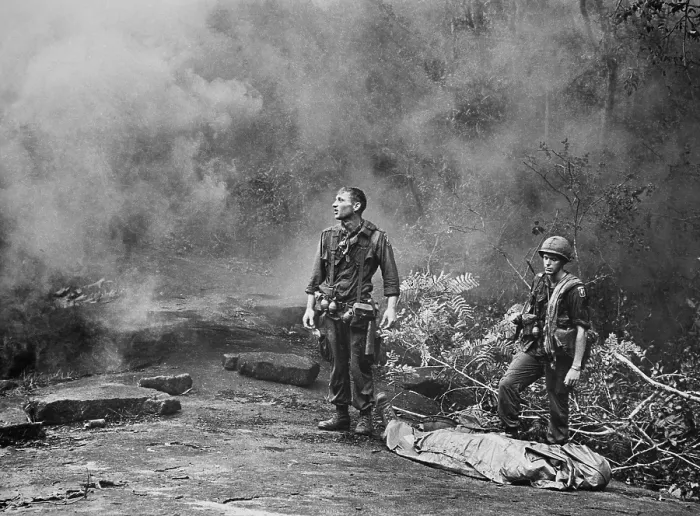 Framed Print : Vietnam War. Two American GIs standing over the body of a fallen comrade after the day's battle was finished. Long Khanh Province, Republic of Vietnam, 1966 Framed Print : Vietnam War. Two American GIs standing over the body of a fallen comrade after the day's battle was finished. Long Khanh Province, Republic of Vietnam, 1966