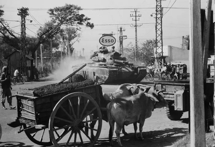 Framed Print : Vietnam War. A US Army tank shares the streets of Saigon with ox carts during the second year of the US escalation of the war. 1966 Framed Print : Vietnam War. A US Army tank shares the streets of Saigon with ox carts during the second year of the US escalation of the war. 1966