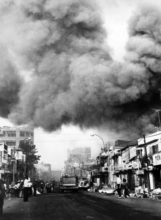 Framed Print : Vietnam War, black smoke over the capital city, fire trucks rush to scenes of fires set during the attacks by the Viet Cong during the Tet holiday period, Saigon, 1968