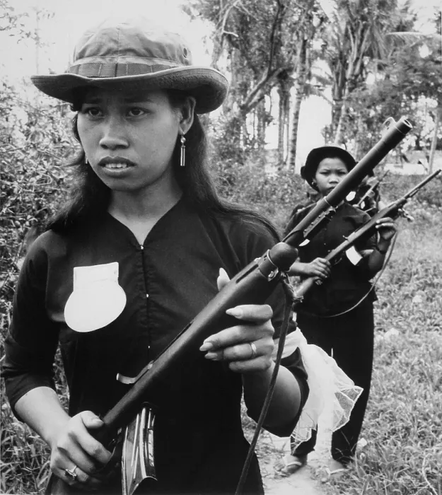 Framed Print : Vietnam War. Girl volunteers with fine manicures and jewelry, are part of the People's Self-Defense Force of Kien Dien