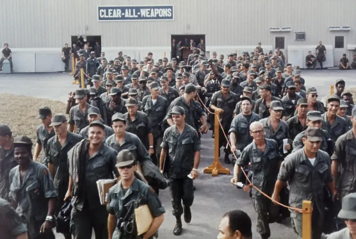 Framed Print : Vietnam War. Having finished their tours of duty, smiling US troops wait at the Bien Hoa Air Terminal for a National Airlines flight home. Feb. 15, 1968 Framed Print : Vietnam War. Having finished their tours of duty, smiling US troops wait at the Bien Hoa Air Terminal for a National Airlines flight home. Feb. 15, 1968