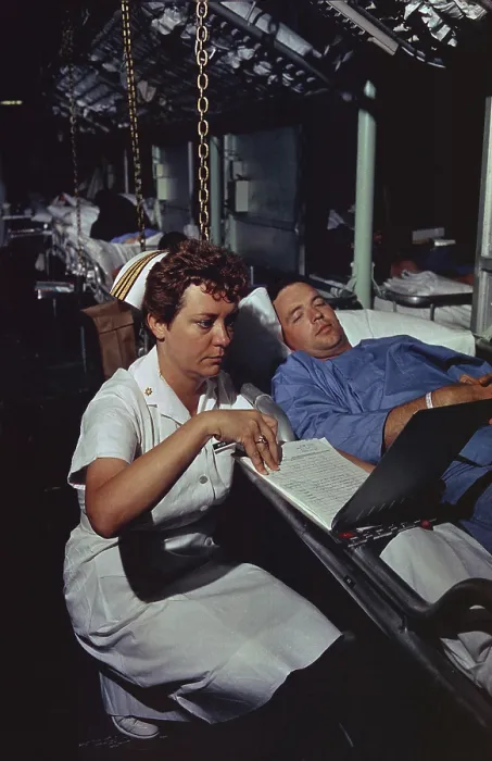 Framed Print : Vietnam War. Lieutenant Commander Dorothy Ryan, an Navy Nurse aboard the hospital ship USS Repose off South Vietnam, checks a wounded soldier's medical chart. April 4, 1966 Framed Print : Vietnam War. Lieutenant Commander Dorothy Ryan, an Navy Nurse aboard the hospital ship USS Repose off South Vietnam, checks a wounded soldier's medical chart. April 4, 1966