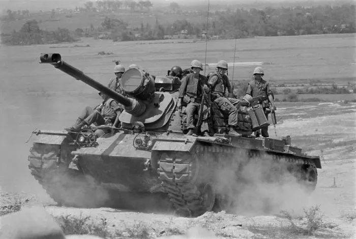 Framed Print : Vietnam War. US Marines riding on an M-48 tank in South Vietnam. 1966