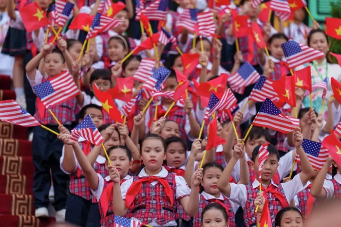 Framed Print : Vietnamese children at the Central Office of the Communist Party of Vietnam, wave American and Vietnamese flags for US President Joe Biden, Sept. 10, 2023. (BSLOC_2023_8_57)