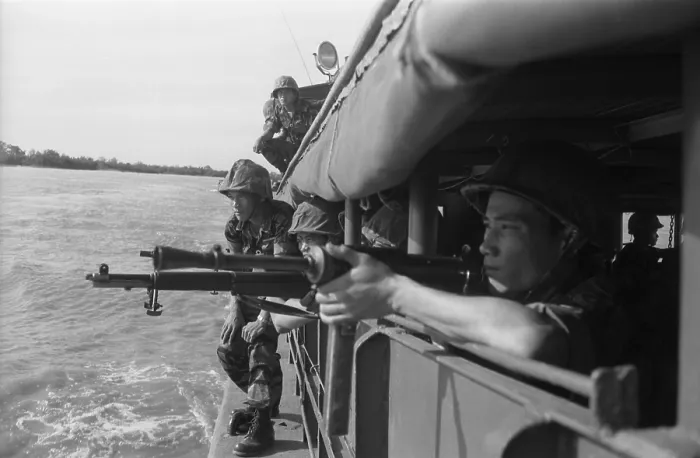 Framed Print : Vietnamese soldiers inspecting the shoreline from inside a boat to prepare for landing. Feb. 15, 1962. Photo by Robert Pepper Martin. (BSLOC_2015_14_134)