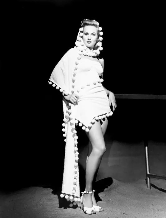 Framed Print : Virginia Mayo modeling a hooded stole over strapless one-piece bathing suit, 1948 Framed Print : Virginia Mayo modeling a hooded stole over strapless one-piece bathing suit, 1948